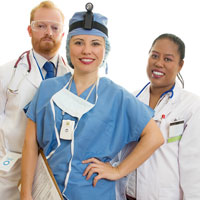 Three medical professionals smiling. There is two females and one male